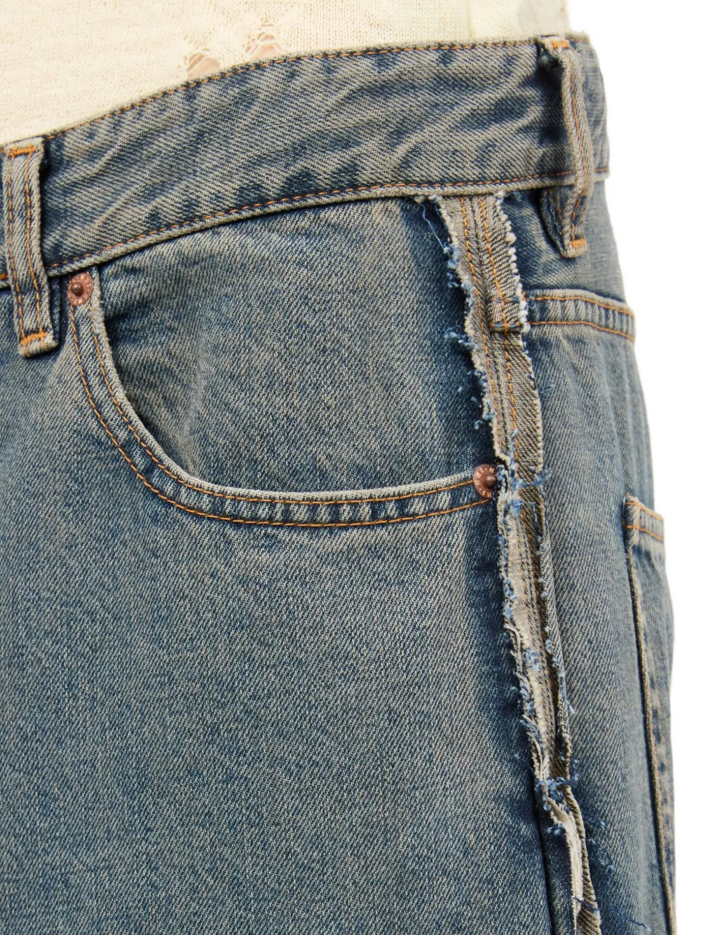 Close up of the grey jeans, showing texture of the cotton fabric