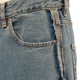 Close up of the grey jeans, showing texture of the cotton fabric