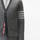 Grey knitwear worn by a person, showing the knitwear fit