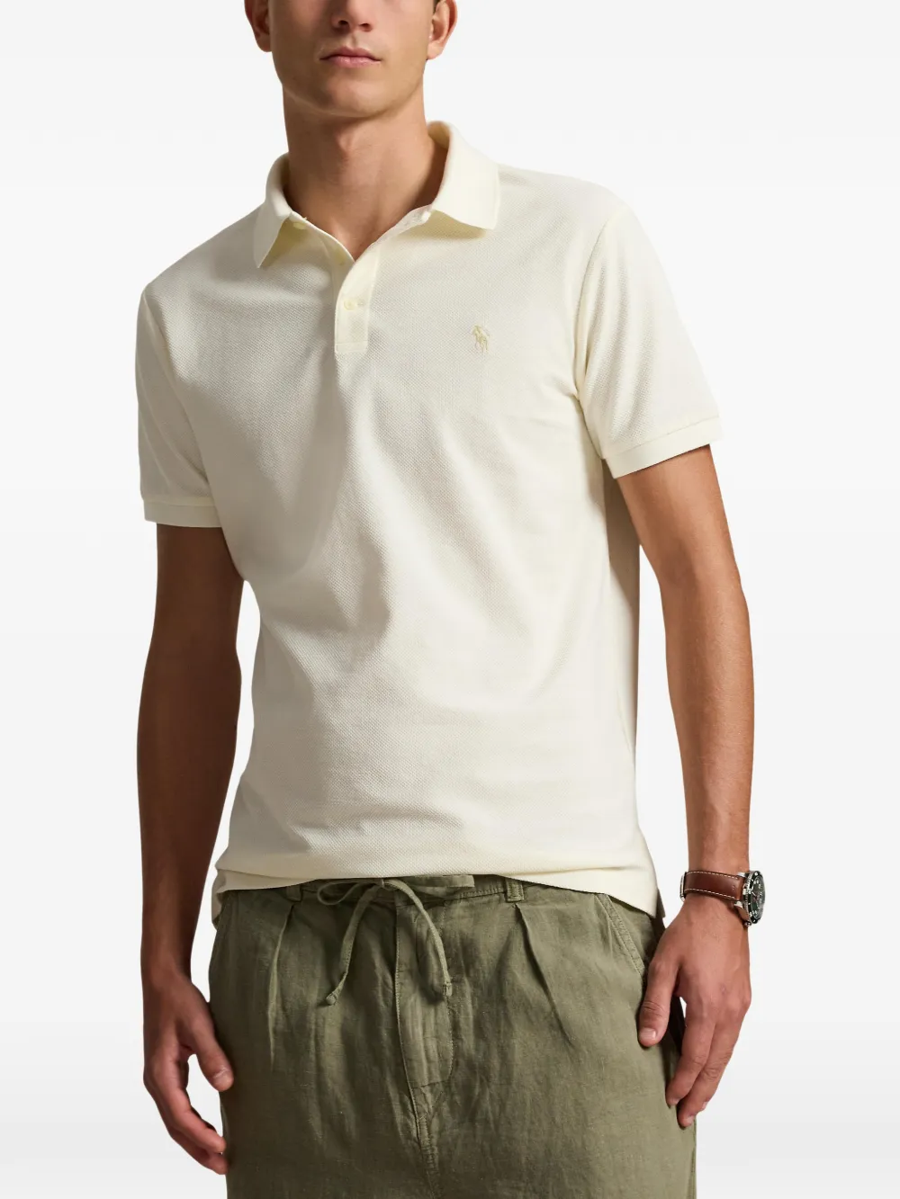 Tan shirt worn by a person, showing the shirt fit