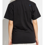 Black tee worn by a person, showing the loose fit