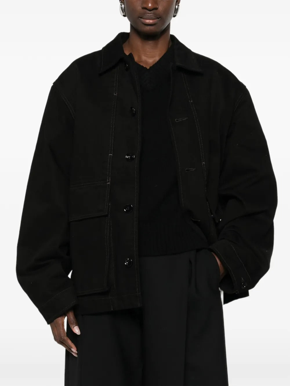 Black jacket worn by a person, showing the jacket fit