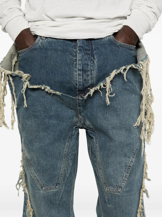 Close up of blue pants, showing texture of the fabric