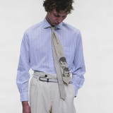 Tan accessories worn by a person, showing the accessories fit