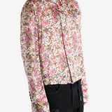 Pink shirt worn by a person, showing the shirt's fit