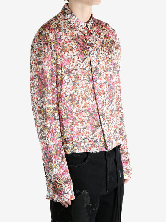 Pink shirt worn by a person, showing the shirt's fit