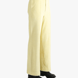 Yellow pants worn by a person, showing the pants' fit
