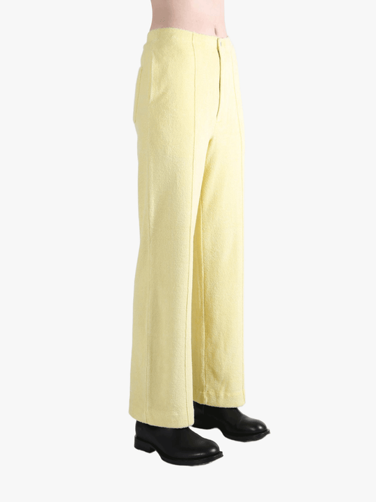 Yellow pants worn by a person, showing the pants' fit