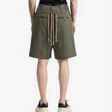 Green shorts, full body view