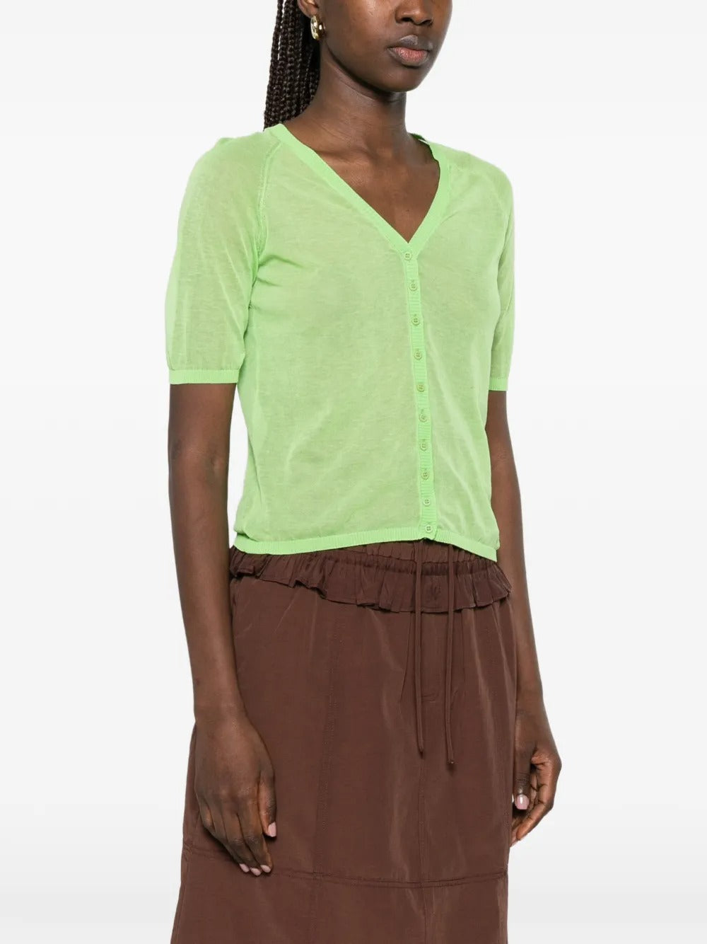 Green top worn by a person, showing the top fit
