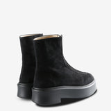 Black boots, back view