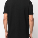 Black shirt worn by a person, showing the  shirts fit