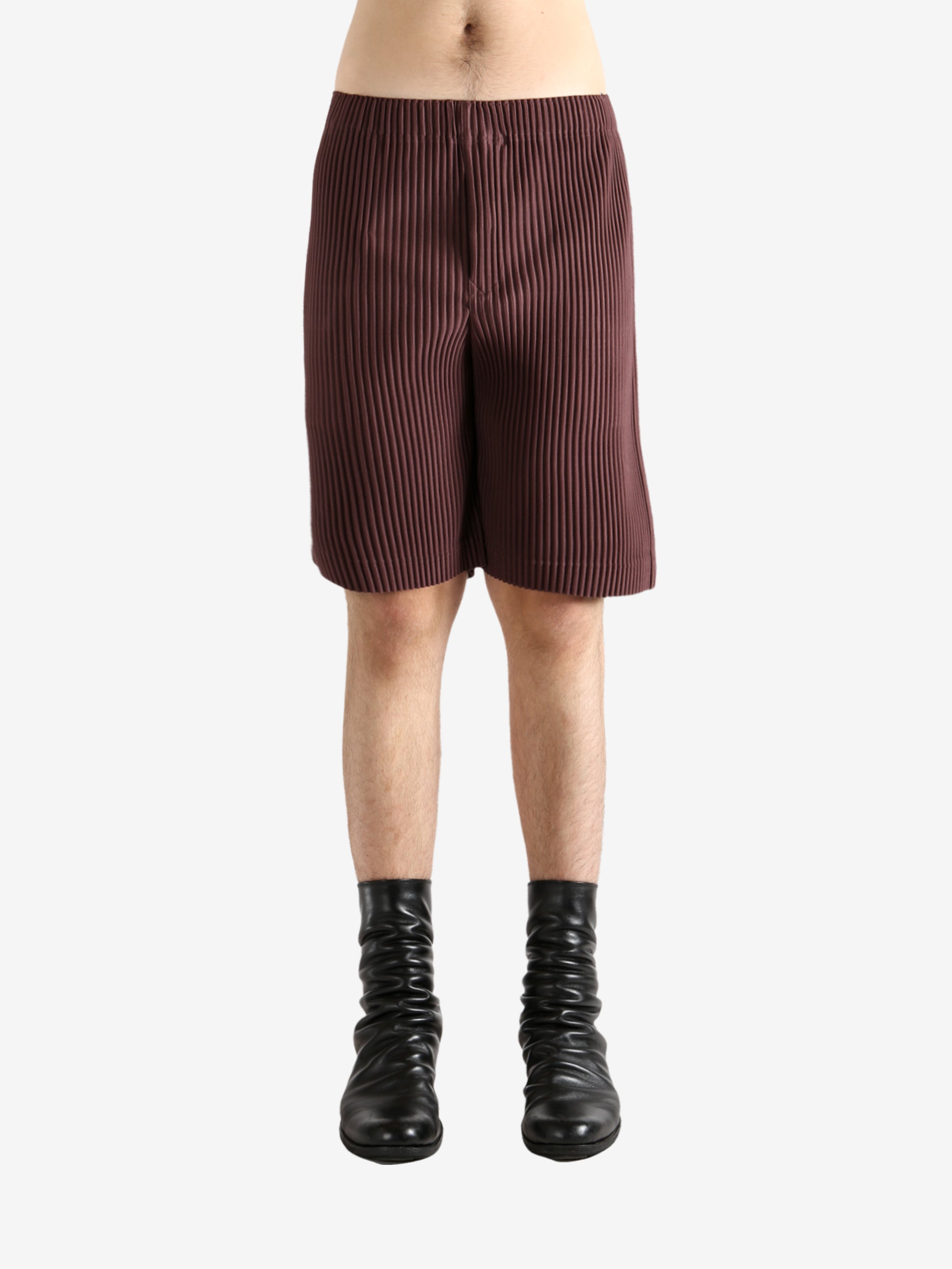 Brown shorts worn by a person, showing the short's fit