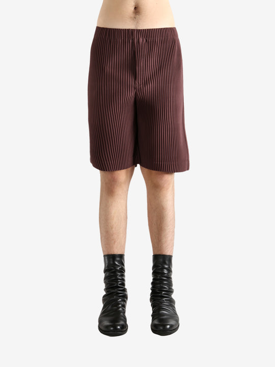 Brown shorts worn by a person, showing the short's fit