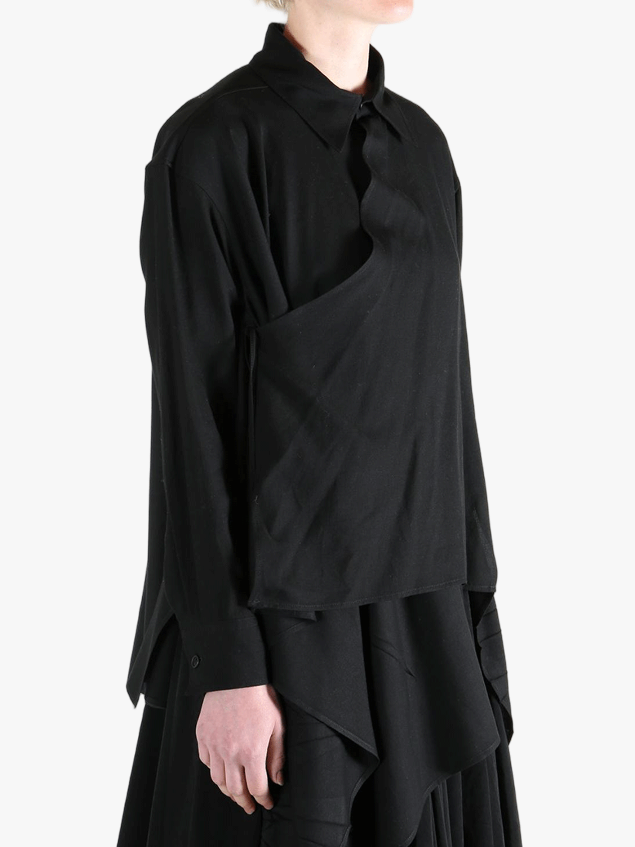 Black shirt worn by a person, showing the shirt's fit