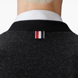 Close up of black knitwear, showing texture of the virgin wool fabric