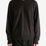 Brown sweater worn by a person, showing the sweater's fit