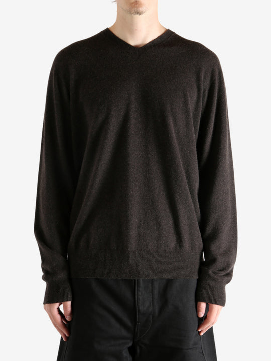 Brown sweater worn by a person, showing the sweater's fit