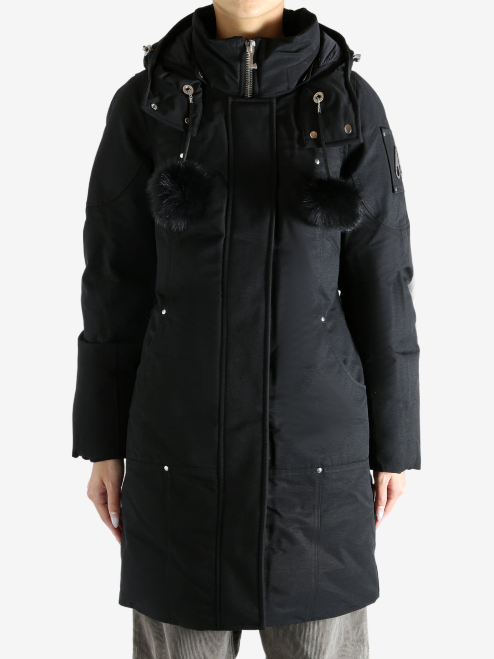 Black parka worn by a person, showing the parka fit