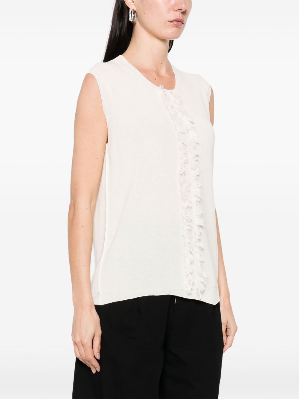 Unknown top worn by a person, showing the top fit