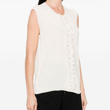 Unknown top worn by a person, showing the top fit