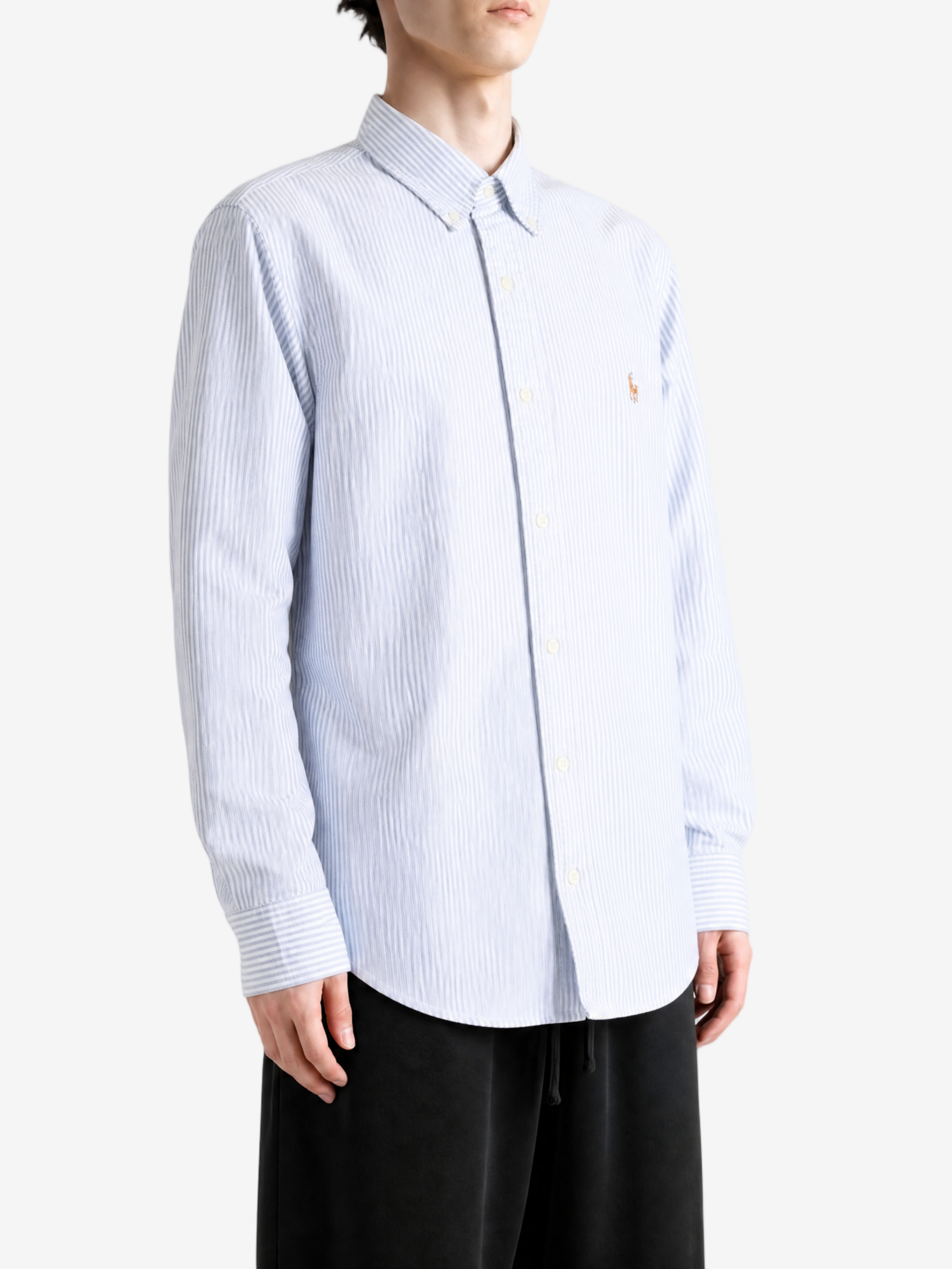 Blue shirt worn by a person, showing the shirt fit