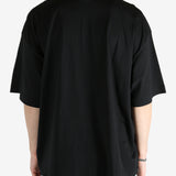 Black t-shirt worn by a person, showing the shirt's fit