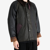 Black jacket worn by a person, showing the jacket fit