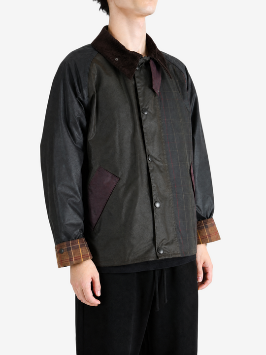 Black jacket worn by a person, showing the jacket fit