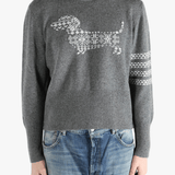 Grey knitwear worn by a person, showing the knitwear fit