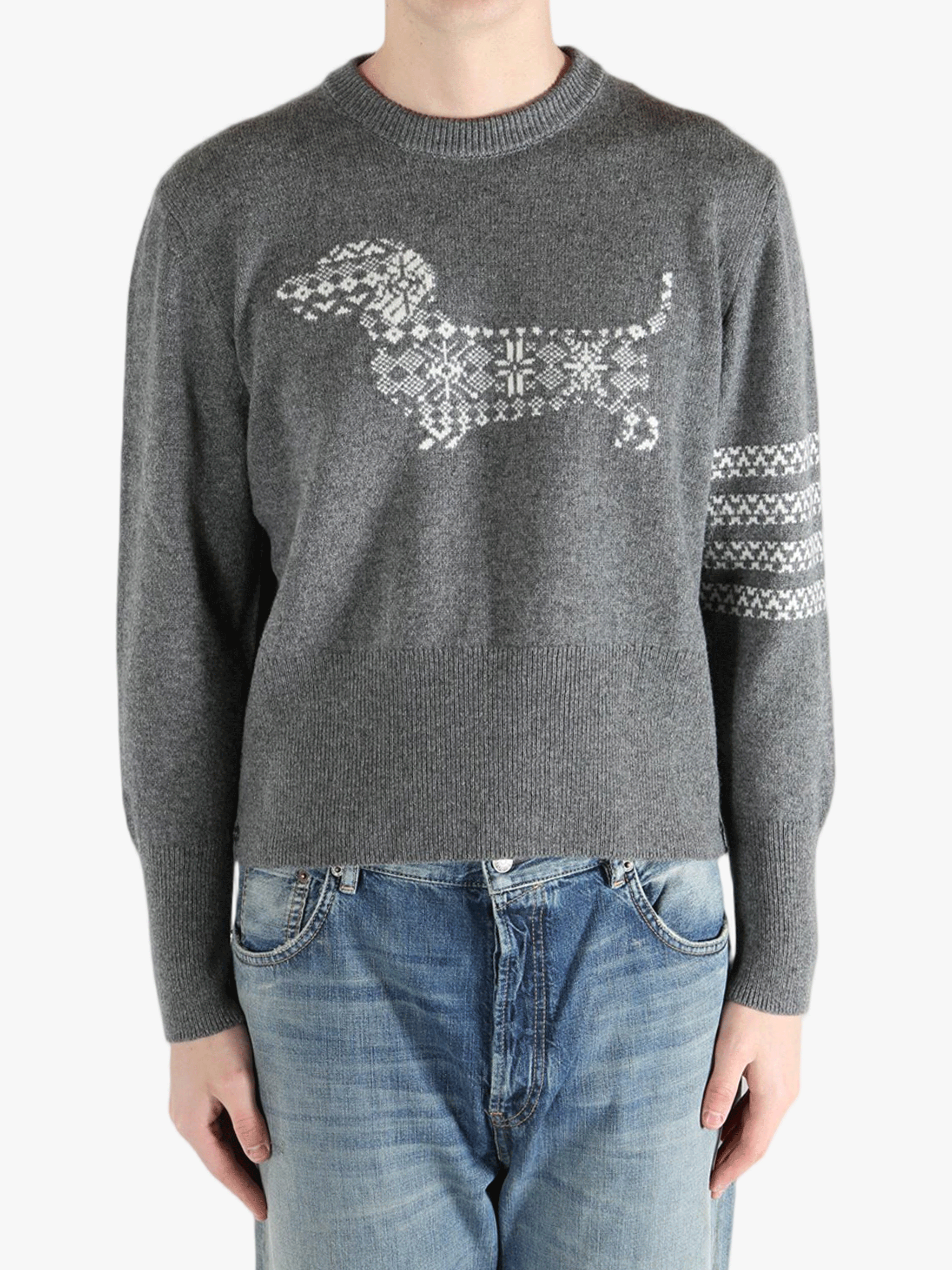 Grey knitwear worn by a person, showing the knitwear fit