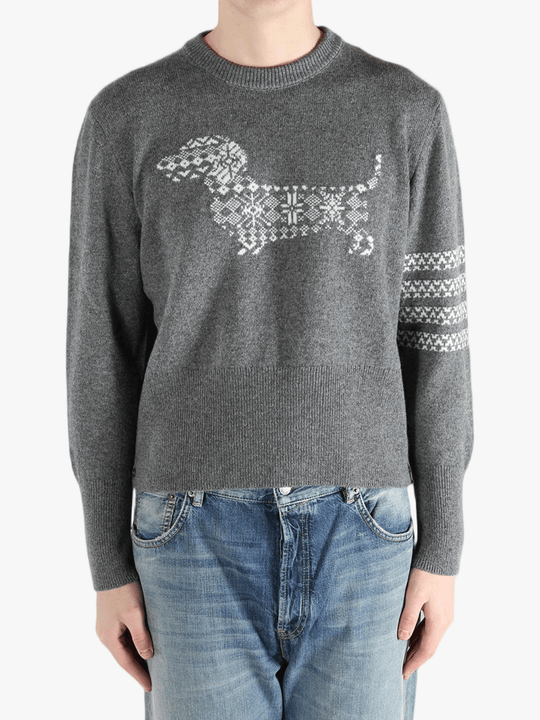 Grey knitwear worn by a person, showing the knitwear fit