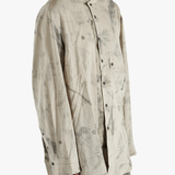 Grey shirt worn by a person, showing the shirt's fit