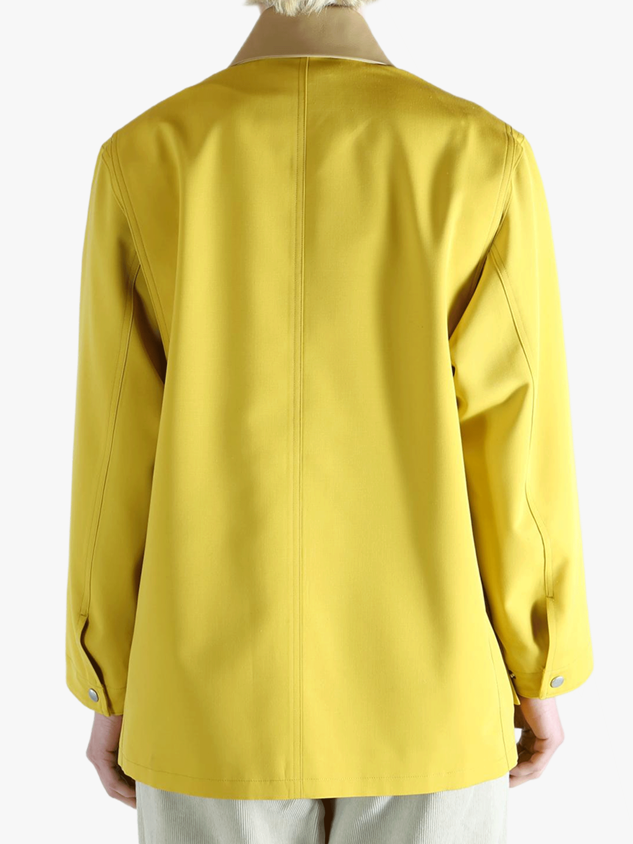 Yellow jacket worn by a person, showing the jacket's fit