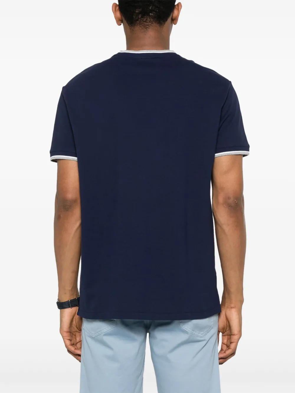 Navy t-shirt,worn by a person, showing the -shirt  fit