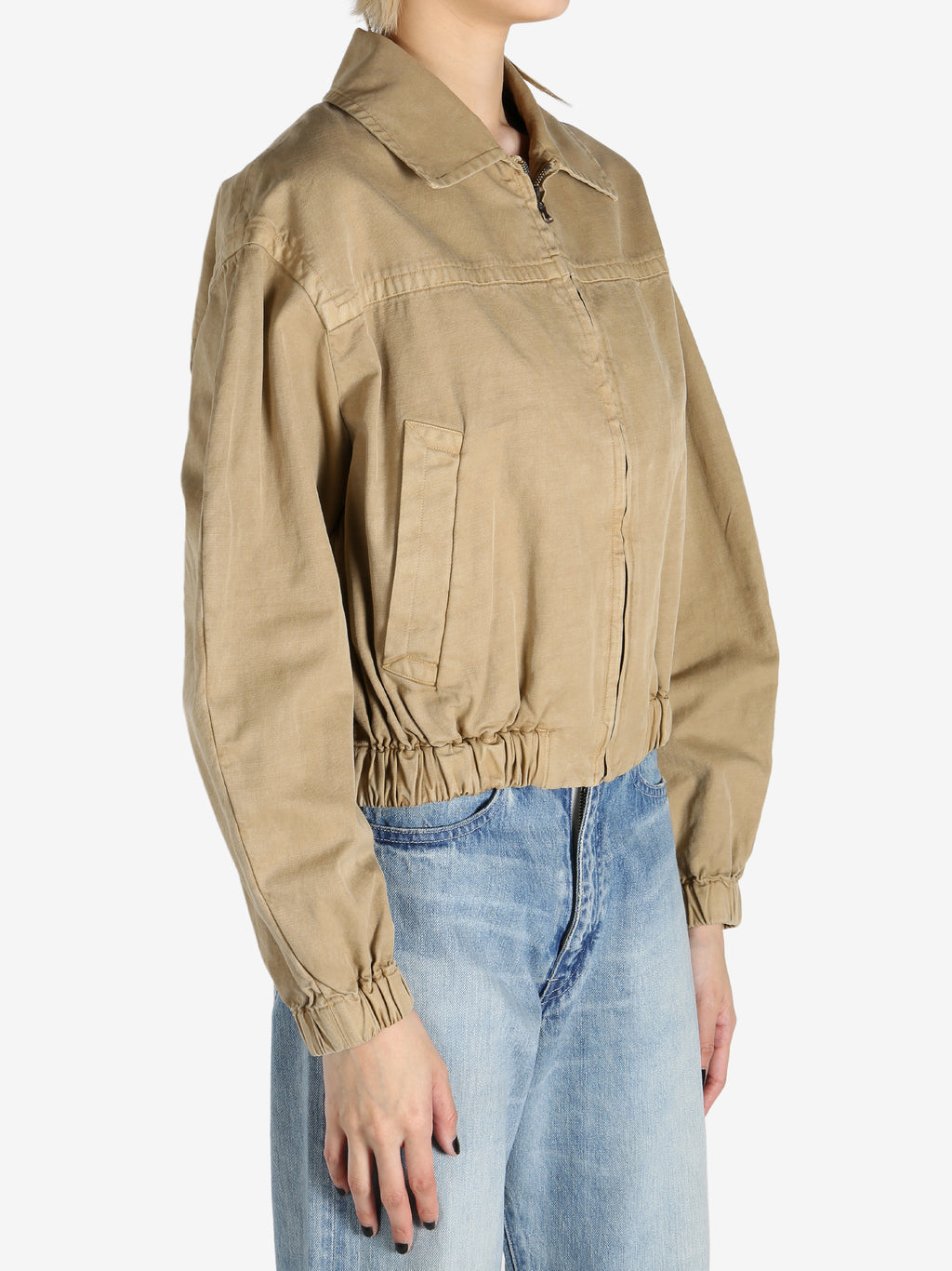 Tan jacket worn by a person, showing the jacket's fit