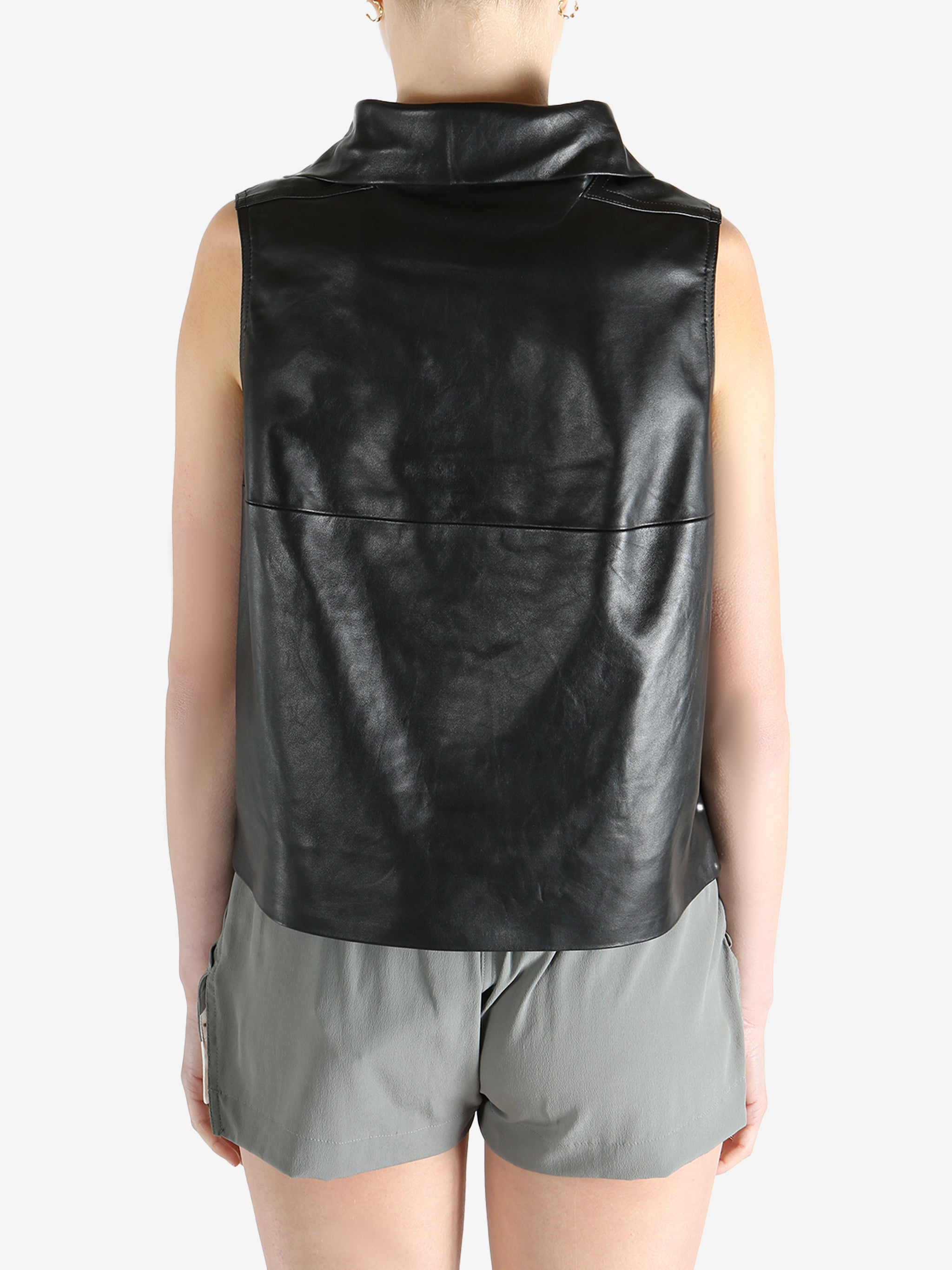 Black top worn by a person, showing the top's fit