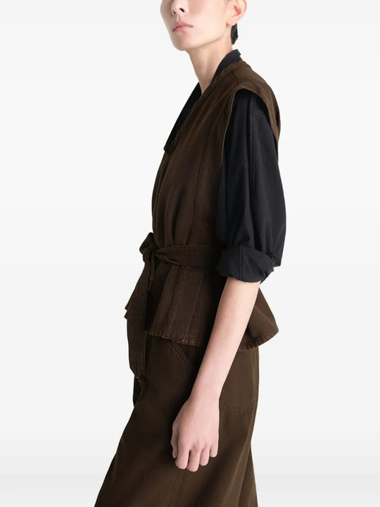 Brown top worn by a person, showing the top's fit