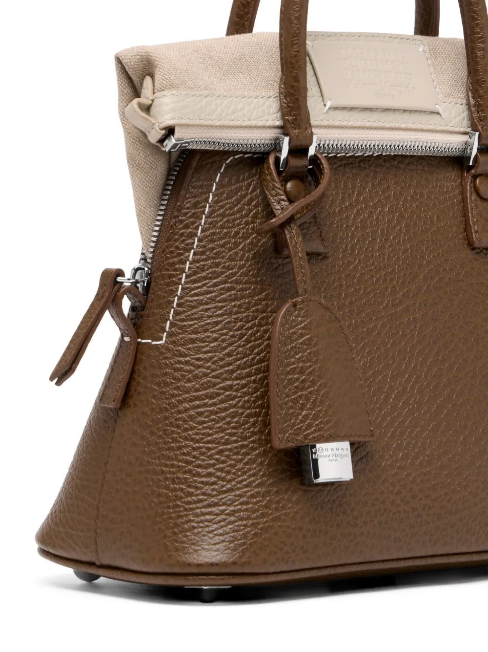 Close up of brown bag, showing texture of the leather fabric