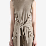 Beige top worn by a person, showing the top fit