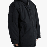 Black jacket worn by a person, showing the jacket fit