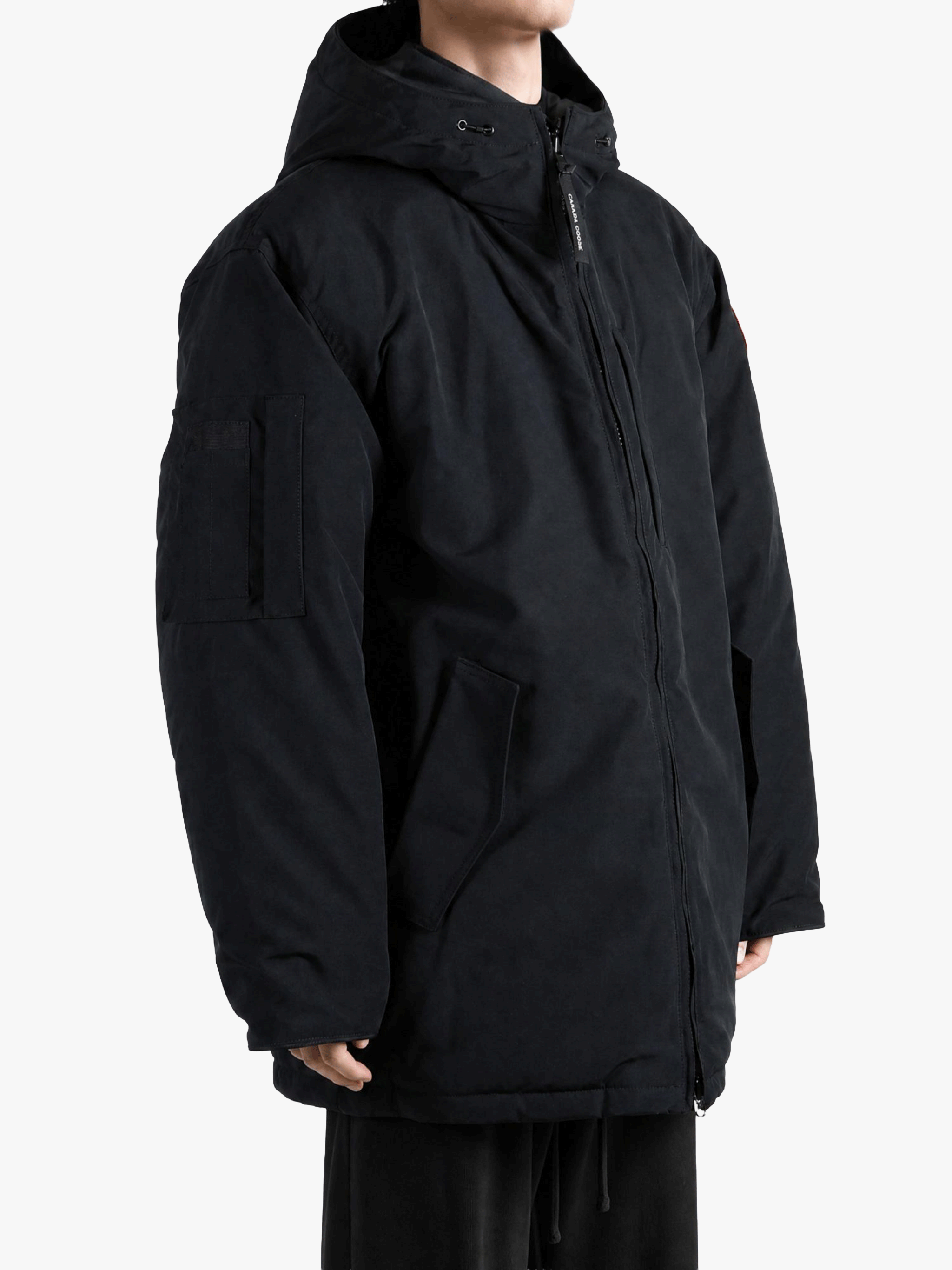 Black jacket worn by a person, showing the jacket fit