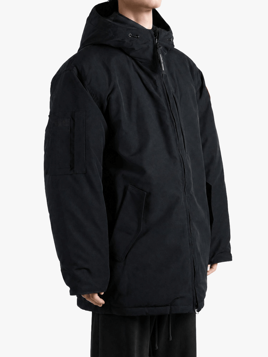 Black jacket worn by a person, showing the jacket fit