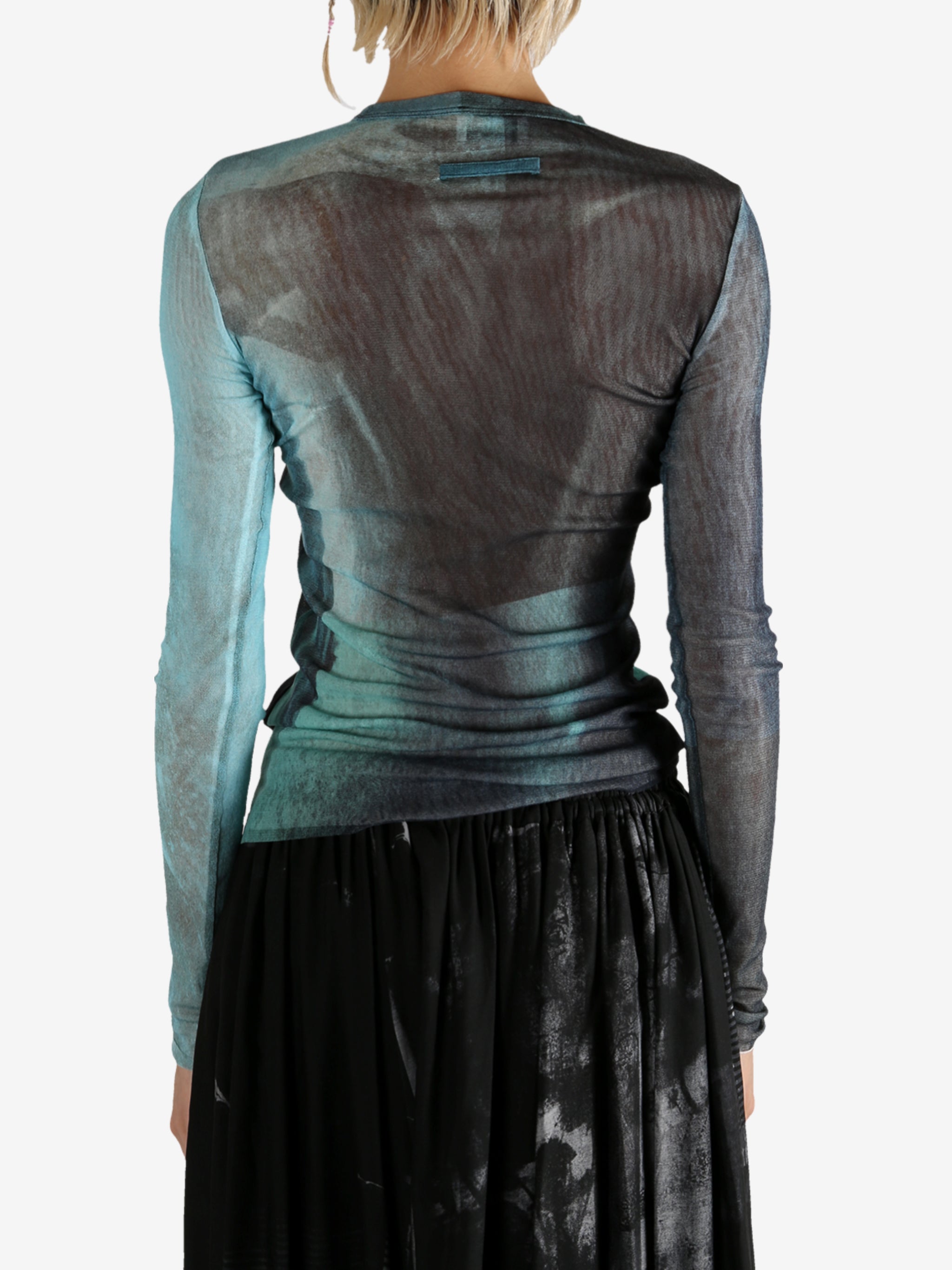 Blue top worn by a person, showing the top's fit