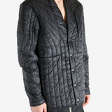 Black jacket worn by a person, showing the jacket's fit