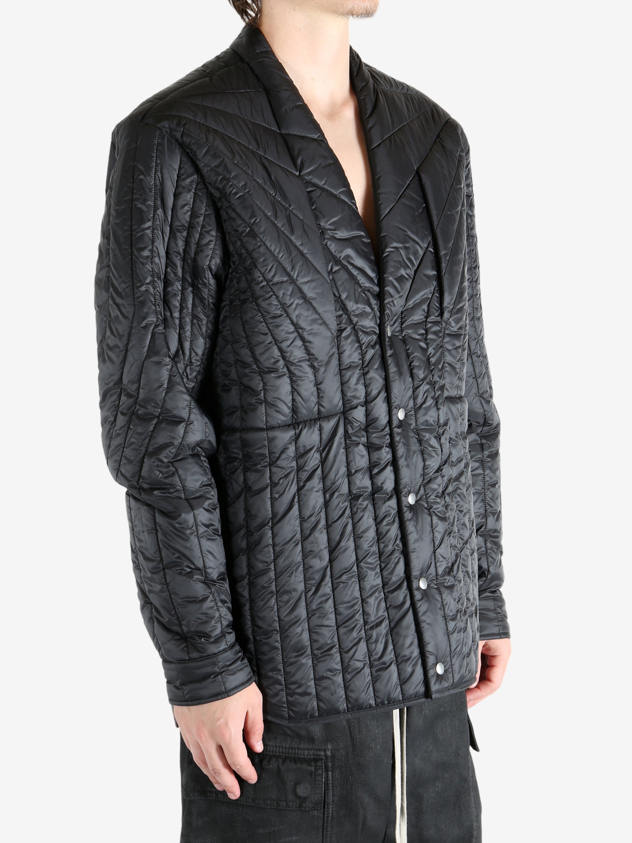 Black jacket worn by a person, showing the jacket's fit