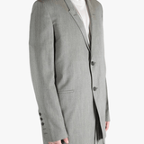 Grey jacket worn by a person, showing the jacket's fit
