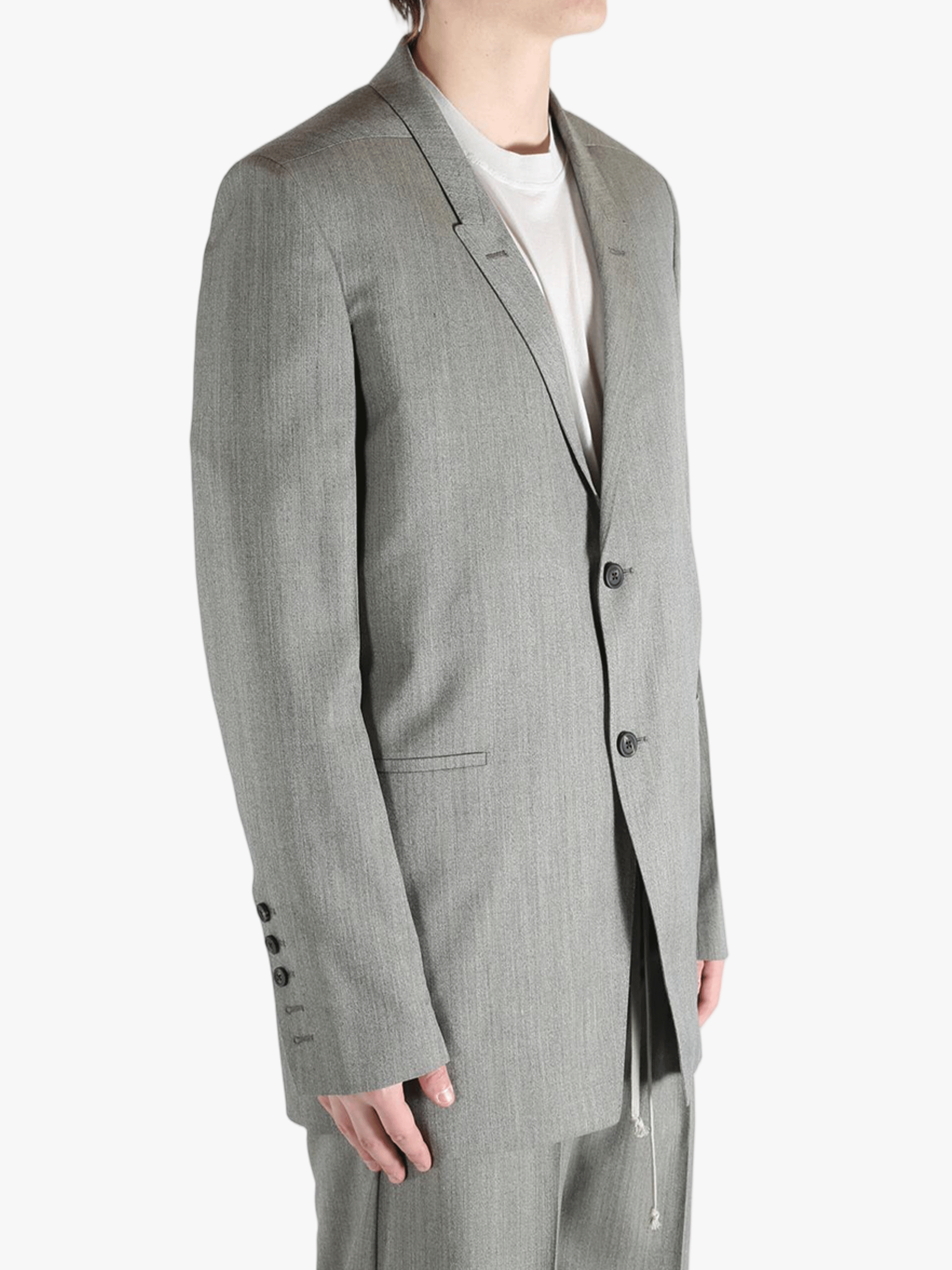 Grey jacket worn by a person, showing the jacket's fit