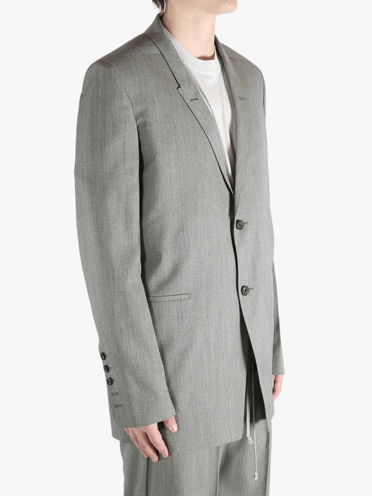 Grey jacket worn by a person, showing the jacket's fit