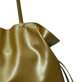 Gold metallic handbag with drawstring on a white background